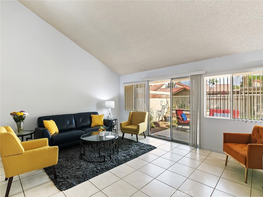 82294 Bergman Drive Indio, CA 92201 - Photo 3 of 22 a living room with furniture and a window