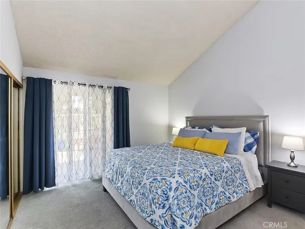 a bedroom with a bed and window