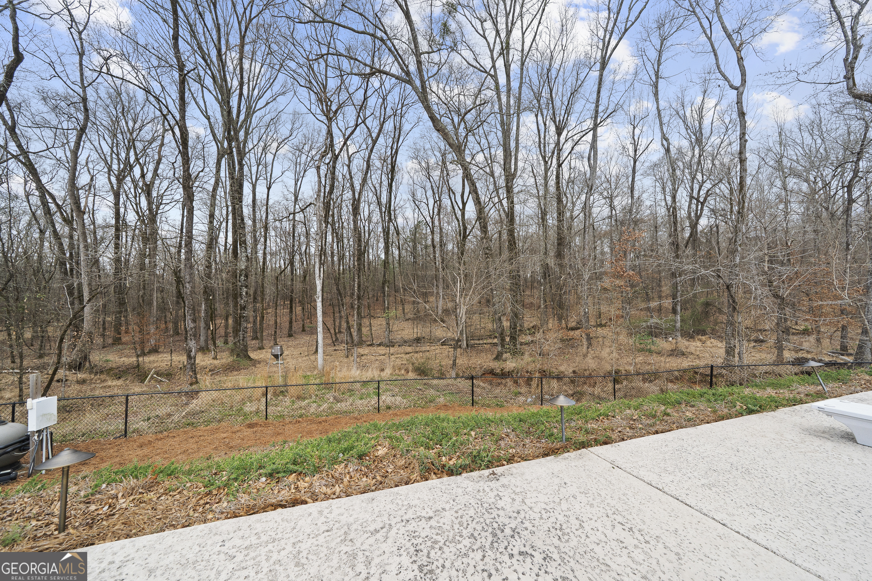 237 Nancy Branch Road Northeast Milledgeville, GA 31061 - Photo 45 of 47 a front view of a house with a yard and trees