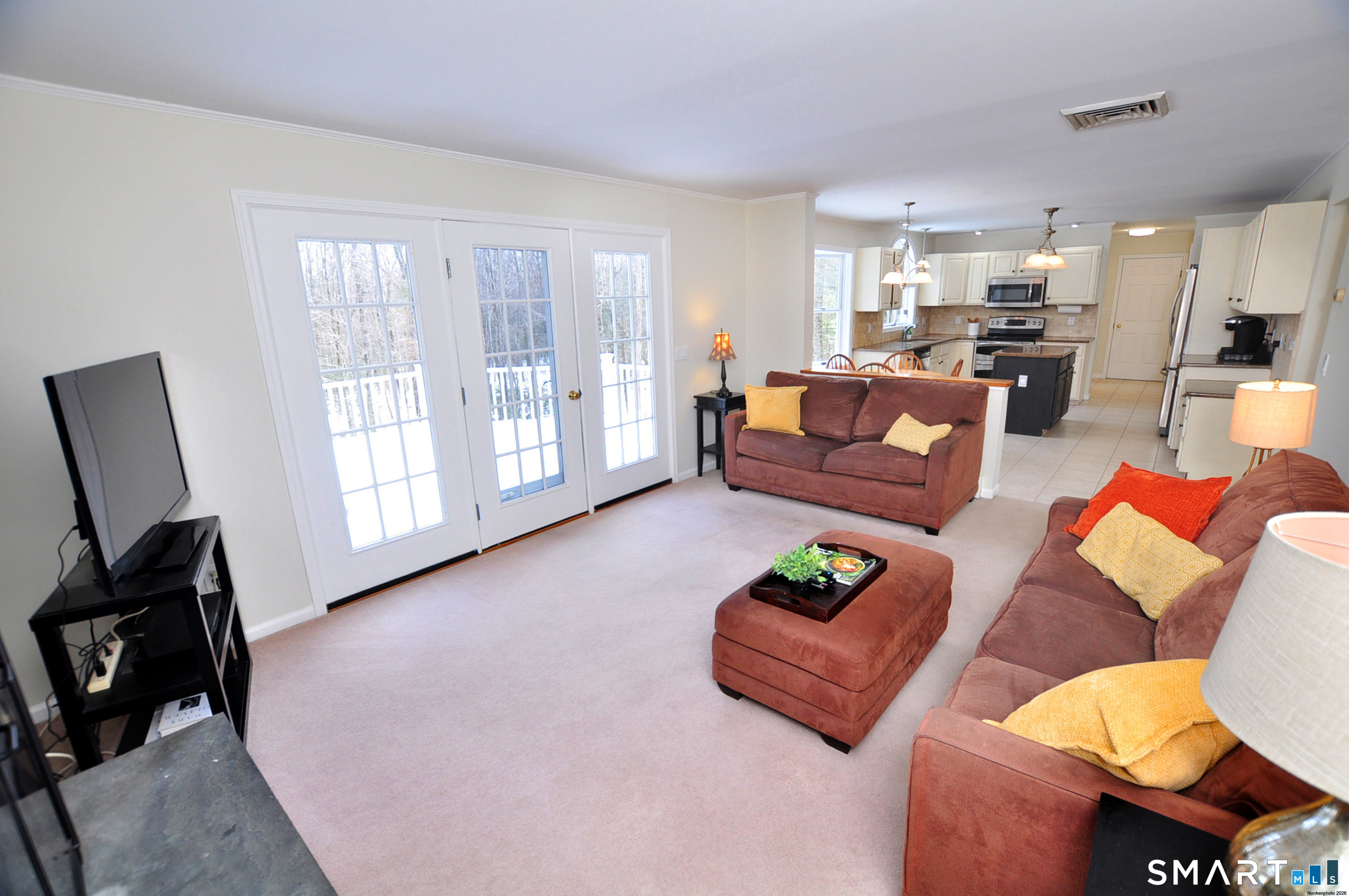 15 Greenwoods Road Granby, CT 06060 - Photo 13 of 41 a living room with furniture and a flat screen tv