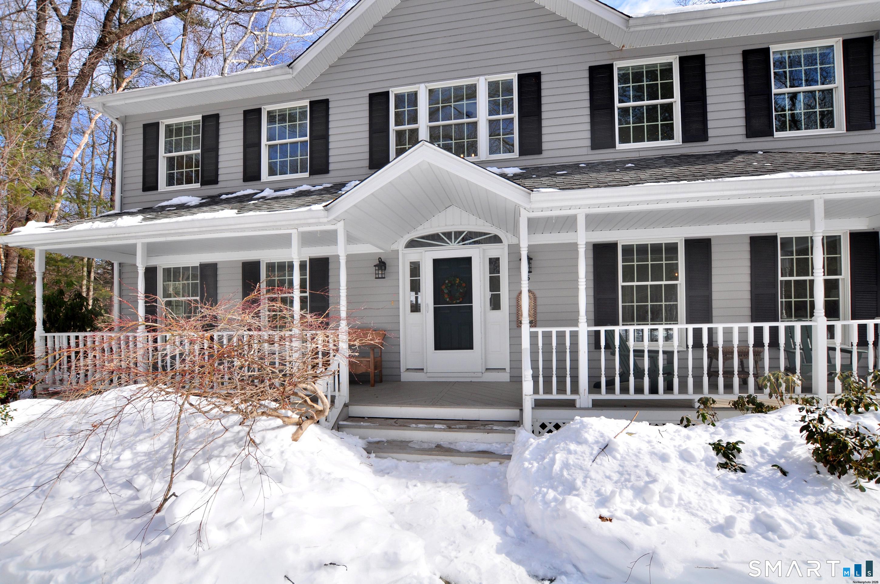 15 Greenwoods Road Granby, CT 06060 - Photo 18 of 41 a front view of a house with a yard