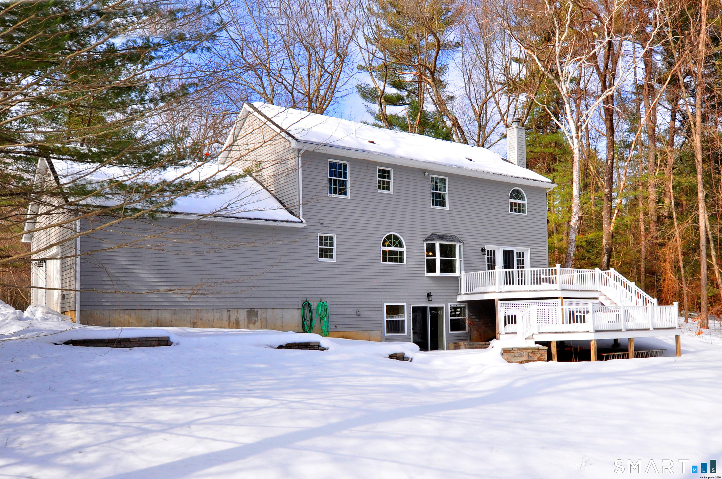 15 Greenwoods Road Granby, CT 06060 - Photo 2 of 41 a front view of a house with a yard and garage