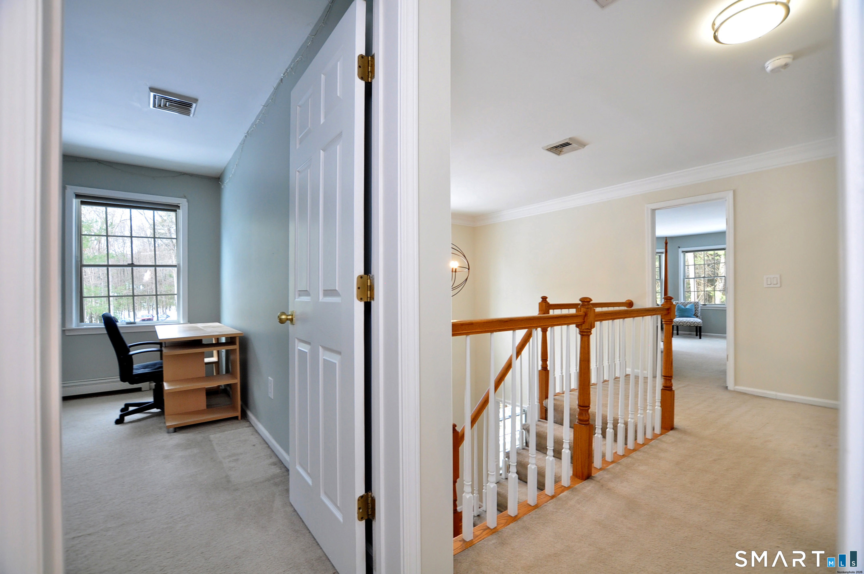 15 Greenwoods Road Granby, CT 06060 - Photo 26 of 41 a view of a hallway with workspace and windows