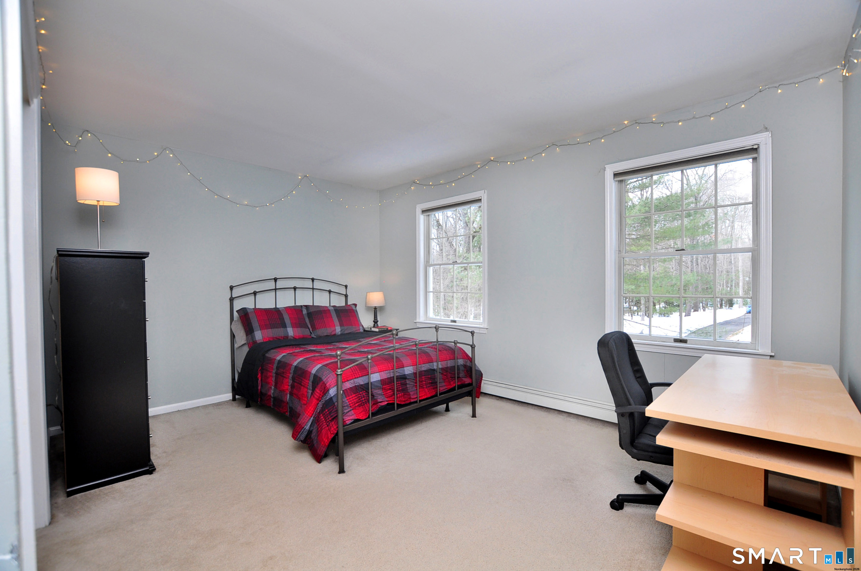 15 Greenwoods Road Granby, CT 06060 - Photo 27 of 41 a bedroom with a bed and windows