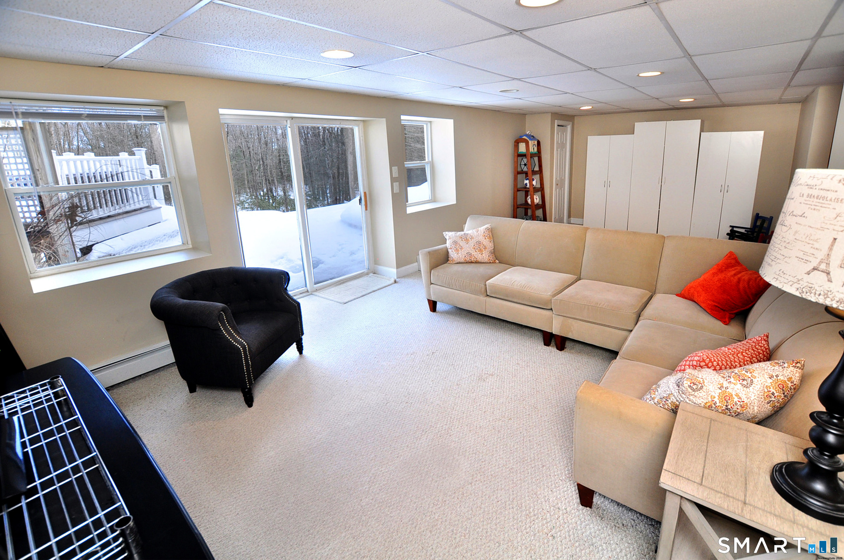 15 Greenwoods Road Granby, CT 06060 - Photo 28 of 41 a living room with furniture lamp and a large window