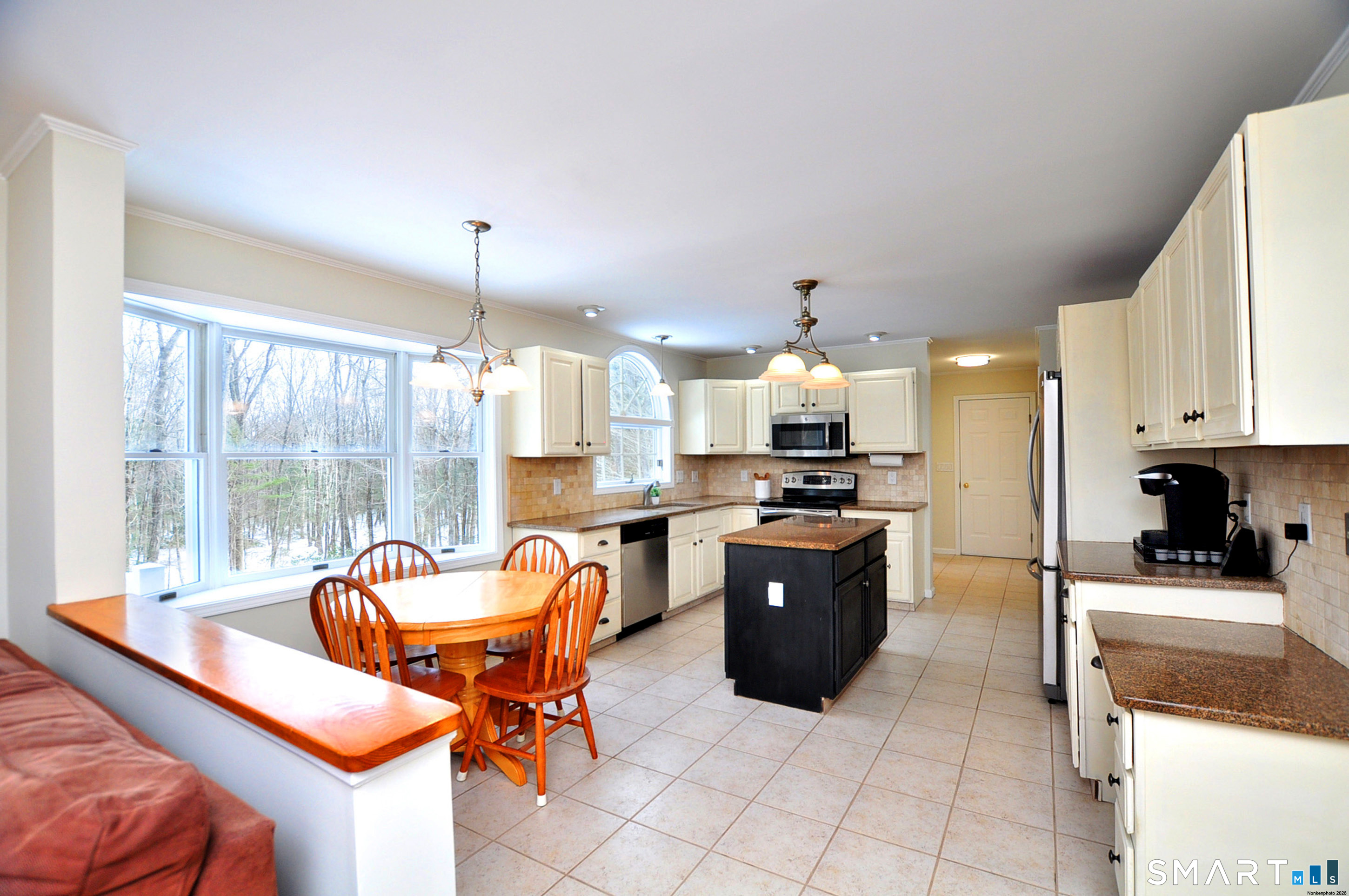 15 Greenwoods Road Granby, CT 06060 - Photo 3 of 41 a kitchen with stainless steel appliances kitchen island granite countertop a sink and a refrigerator