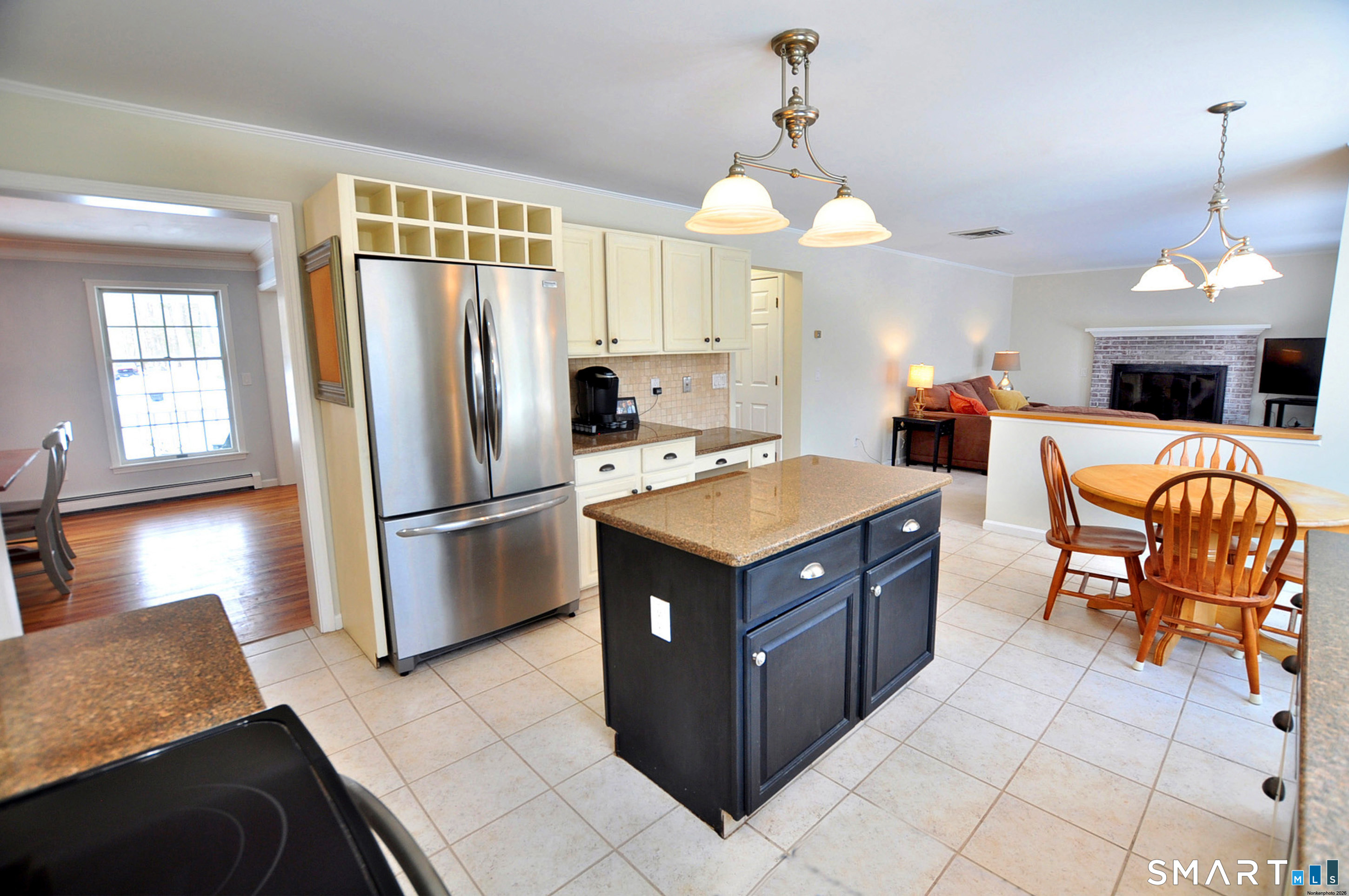 15 Greenwoods Road Granby, CT 06060 - Photo 34 of 41 a kitchen with stainless steel appliances granite countertop a refrigerator a sink a stove and white cabinets