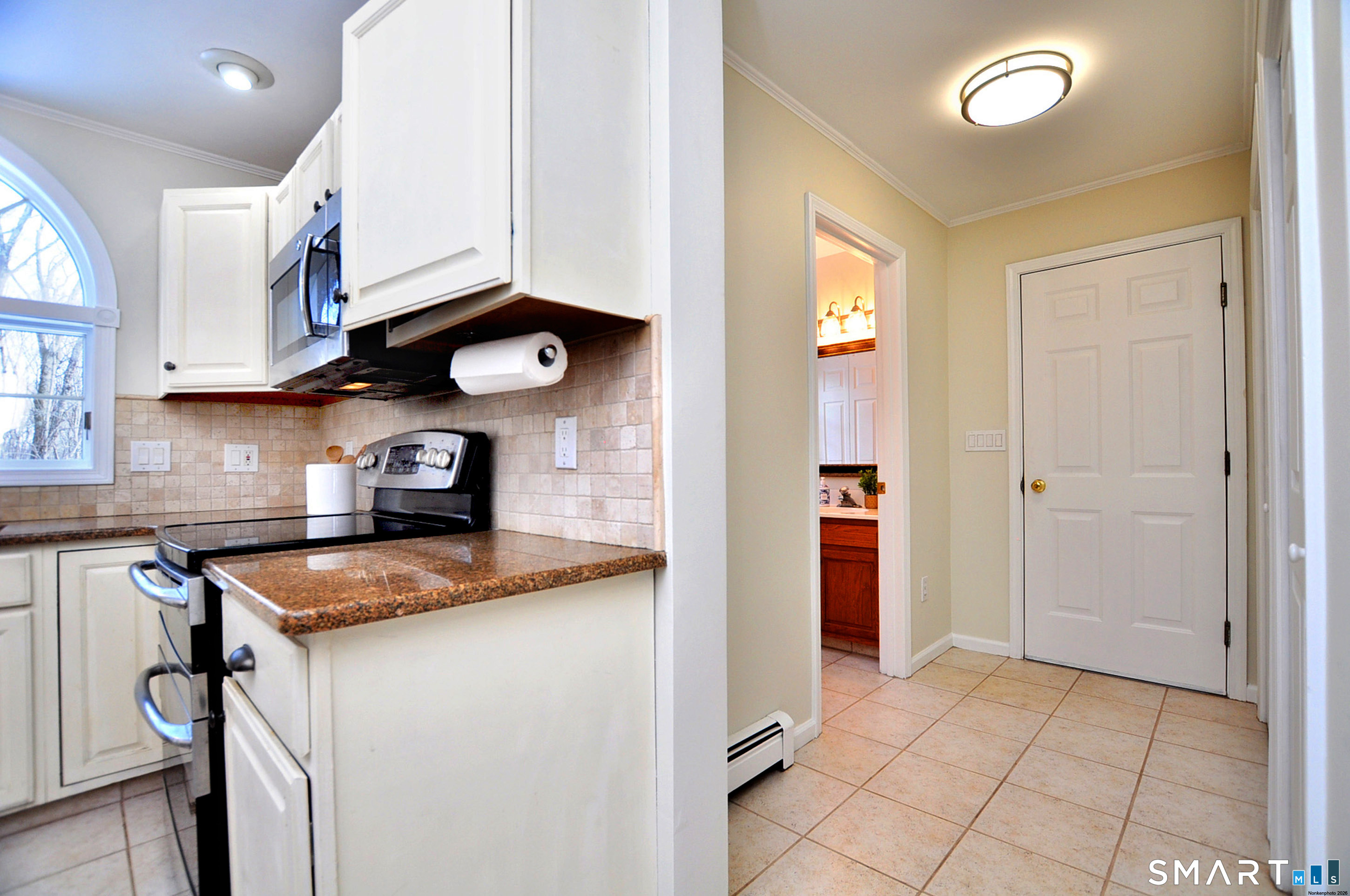 15 Greenwoods Road Granby, CT 06060 - Photo 39 of 41 a kitchen with granite countertop a sink a stove and cabinets