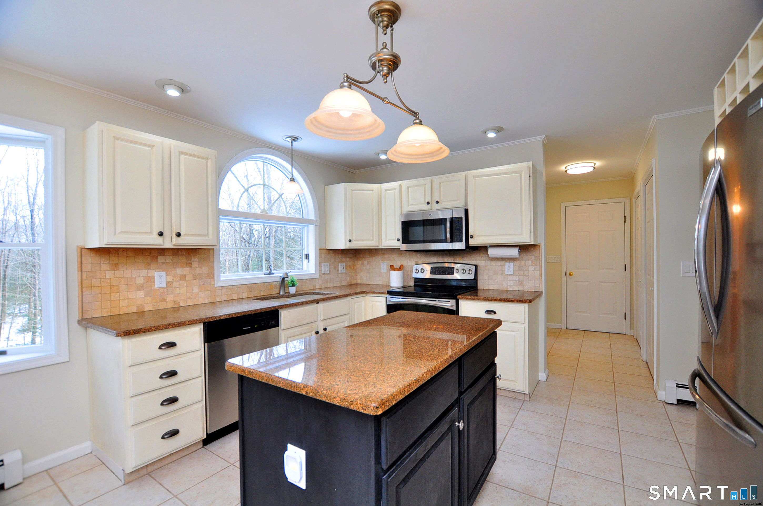 15 Greenwoods Road Granby, CT 06060 - Photo 4 of 41 a kitchen with stainless steel appliances granite countertop a sink a stove and a refrigerator