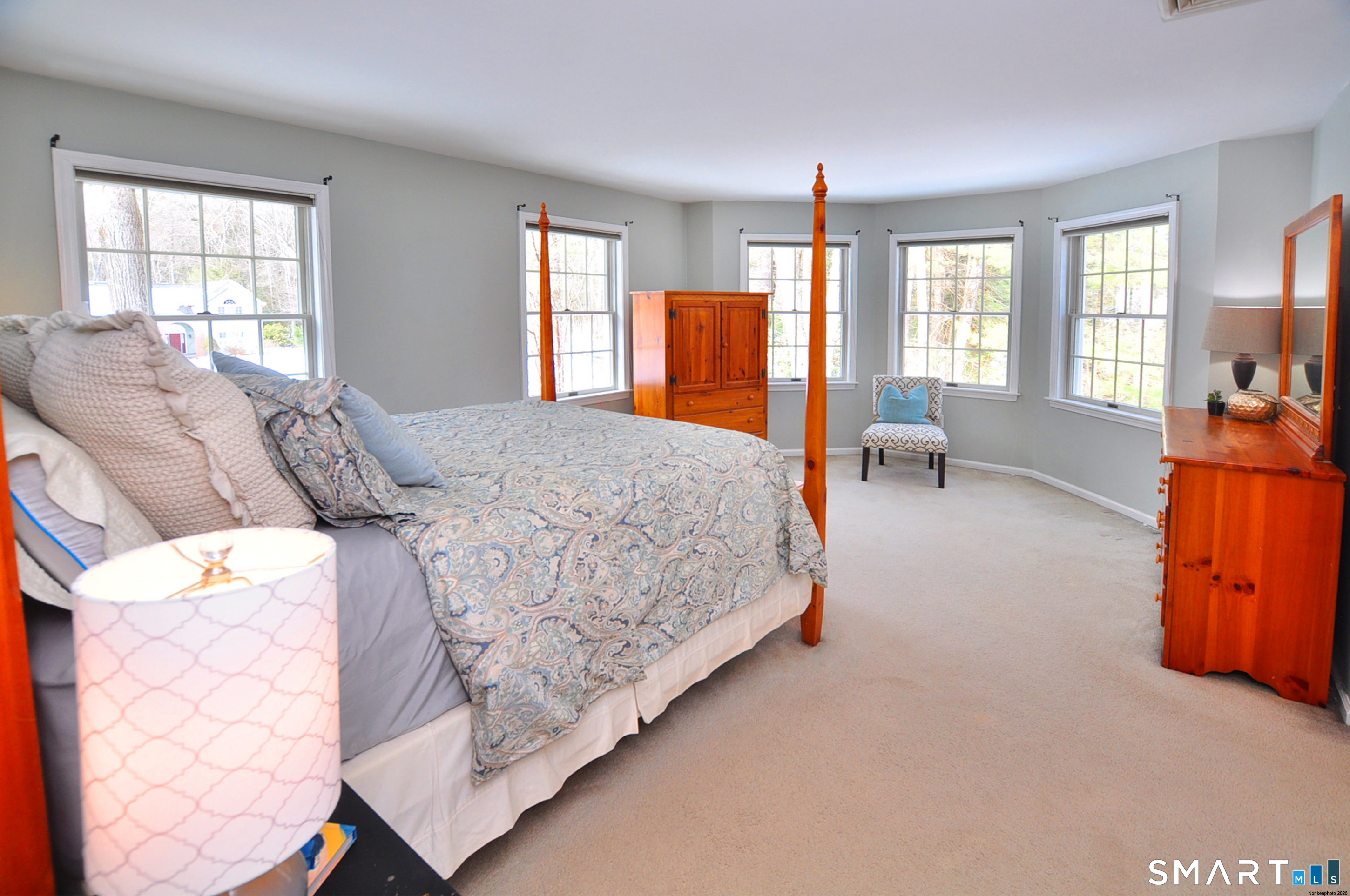 15 Greenwoods Road Granby, CT 06060 - Photo 41 of 41 a bedroom with a bed and large windows