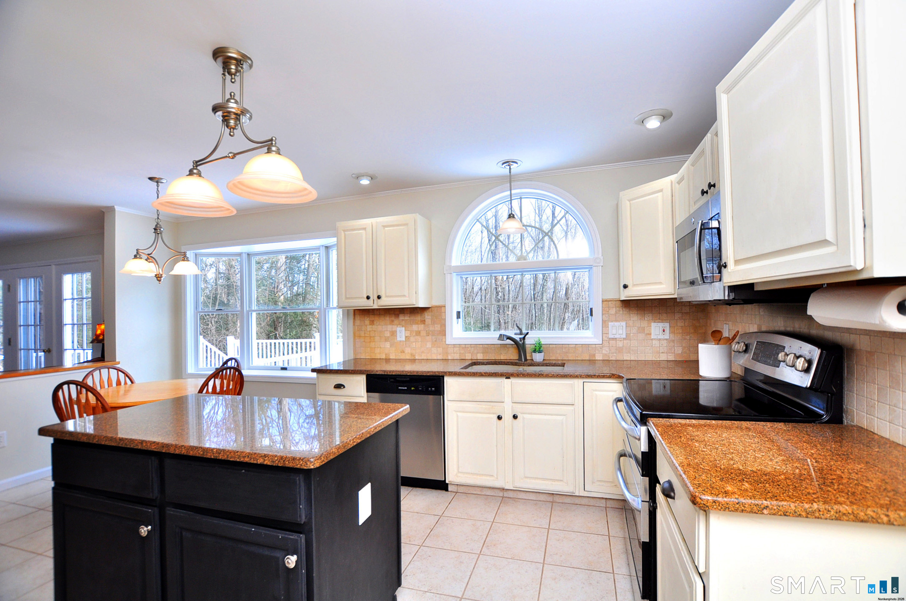 15 Greenwoods Road Granby, CT 06060 - Photo 6 of 41 a kitchen with stainless steel appliances a sink stove and cabinets