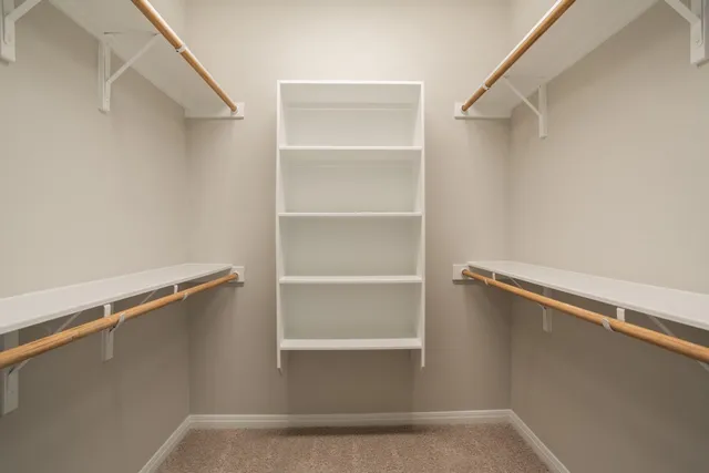 a view of an empty walk in closet