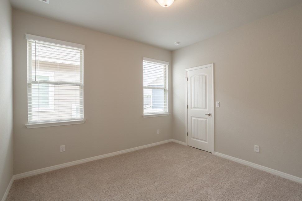 1600 Harwell Loop Kyle, TX 78640 - Photo 23 of 30 an empty room with windows