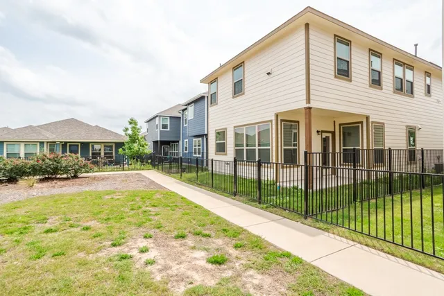 a view of a house with swimming pool and sitting area