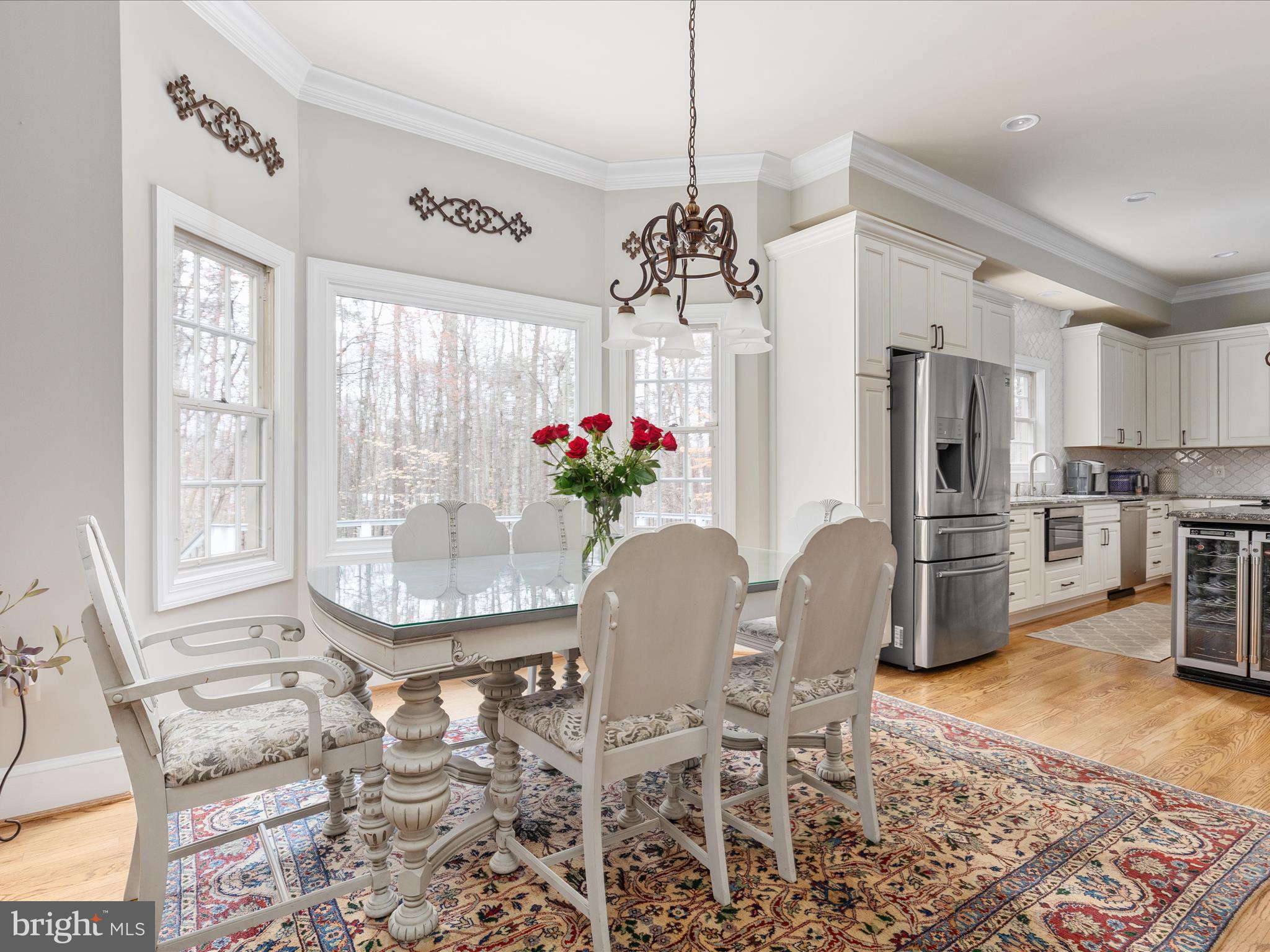 11701 Henderson Road Clifton, VA 20124 - Photo 14 of 61 a dining room with furniture a chandelier and window