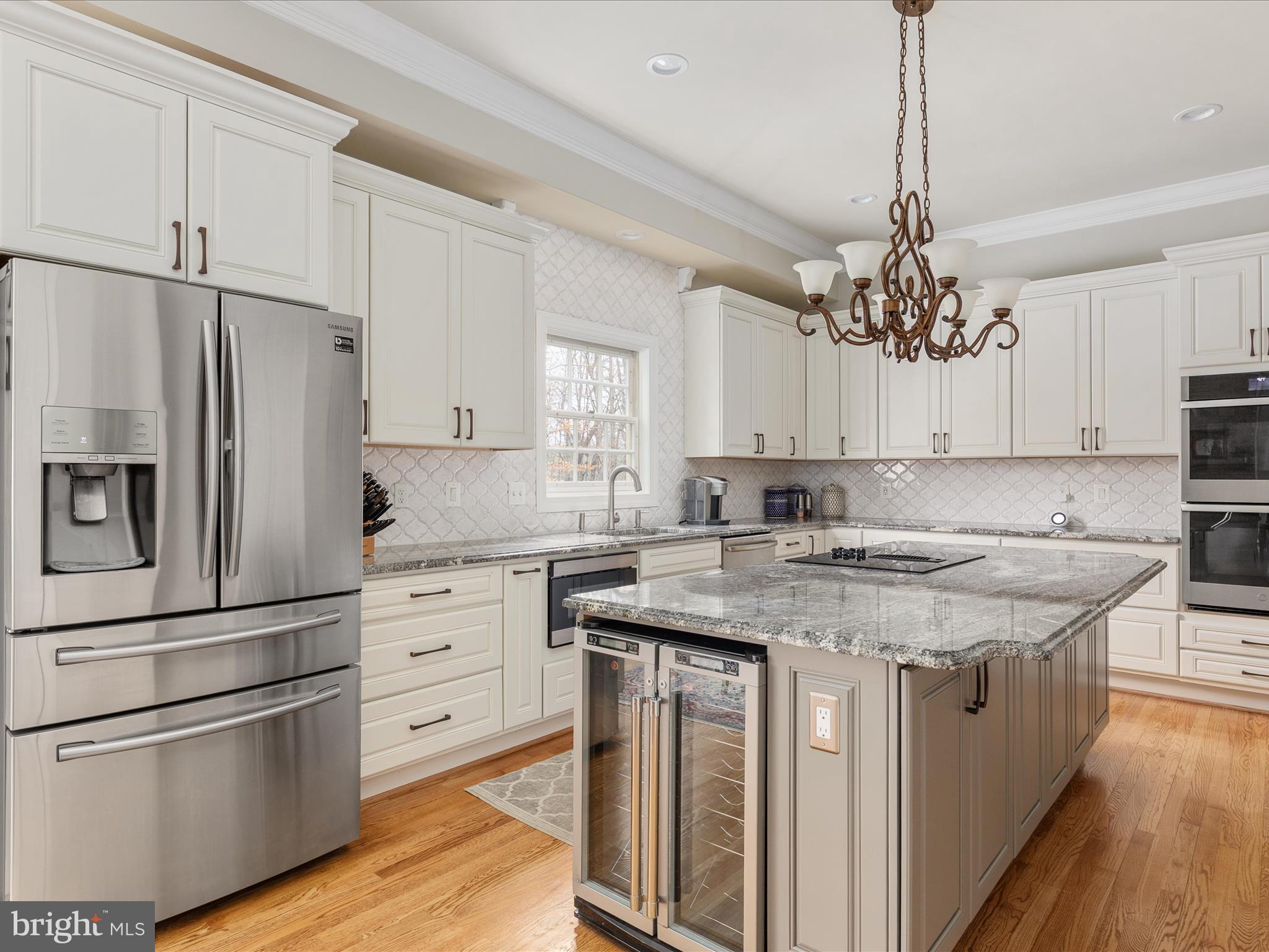 11701 Henderson Road Clifton, VA 20124 - Photo 15 of 61 a kitchen with a refrigerator sink and cabinets