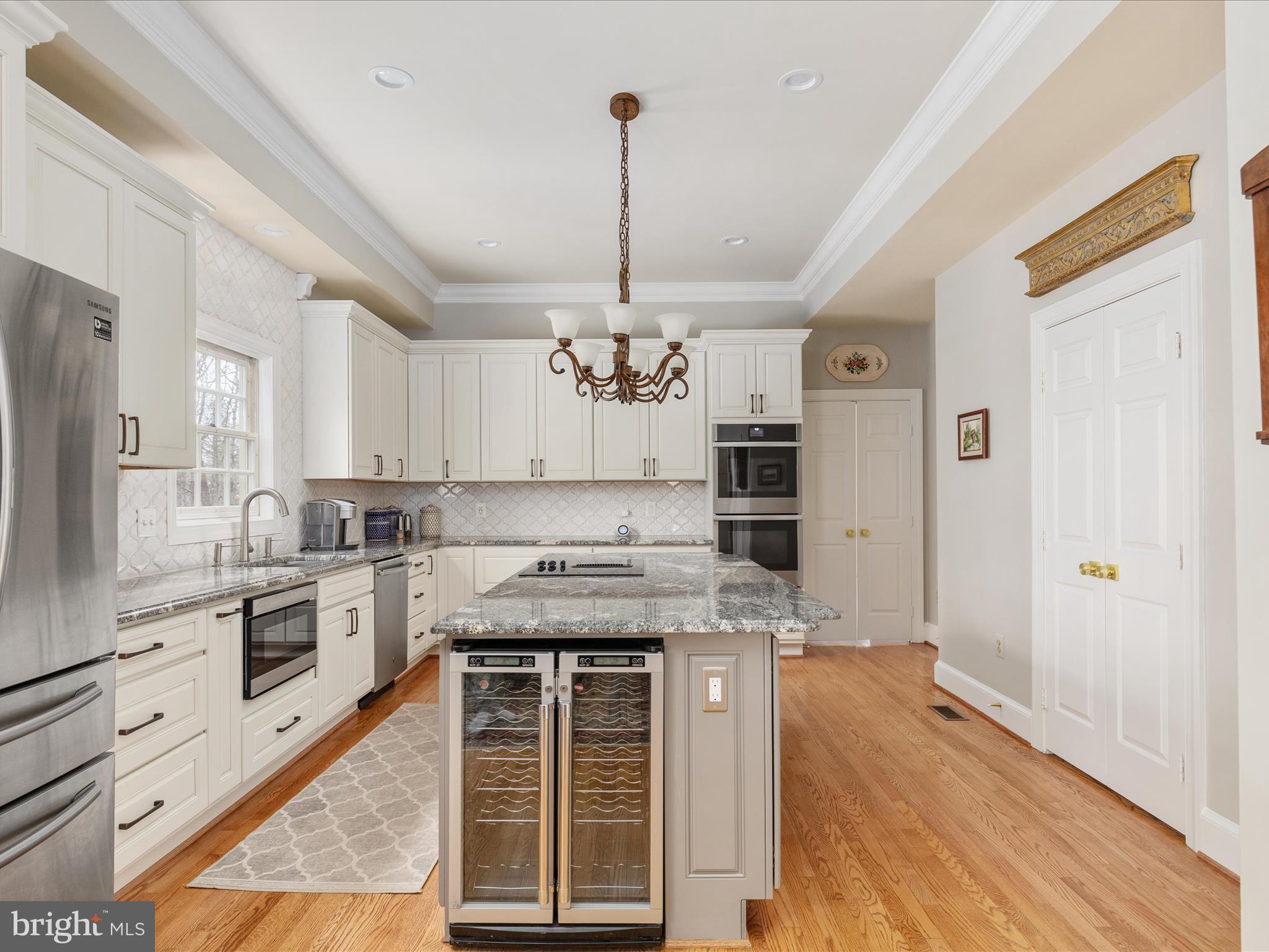 11701 Henderson Road Clifton, VA 20124 - Photo 16 of 61 a kitchen with stainless steel appliances granite countertop a stove refrigerator and cabinets