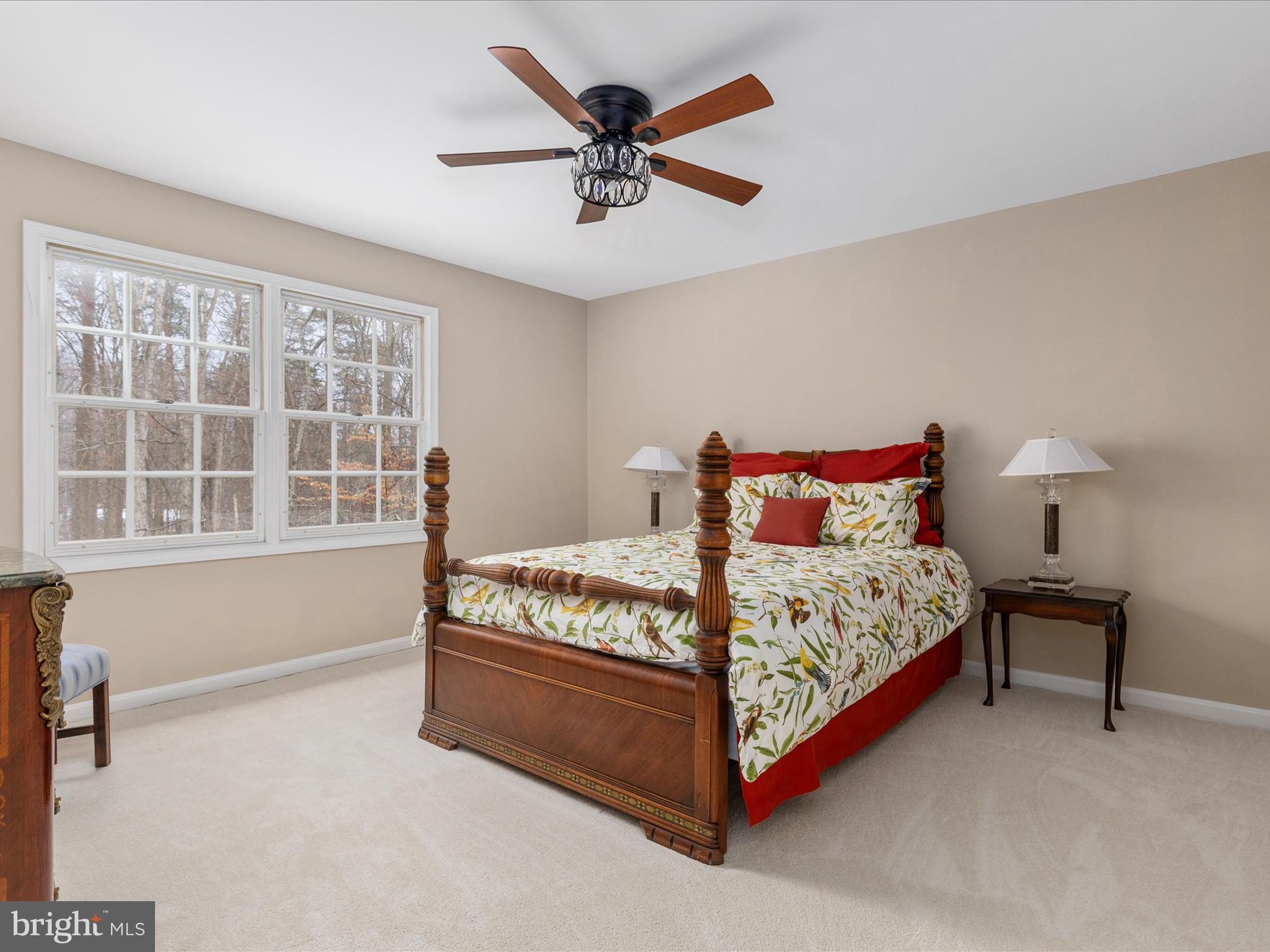 11701 Henderson Road Clifton, VA 20124 - Photo 22 of 61 a bed sitting in a bedroom next to a window