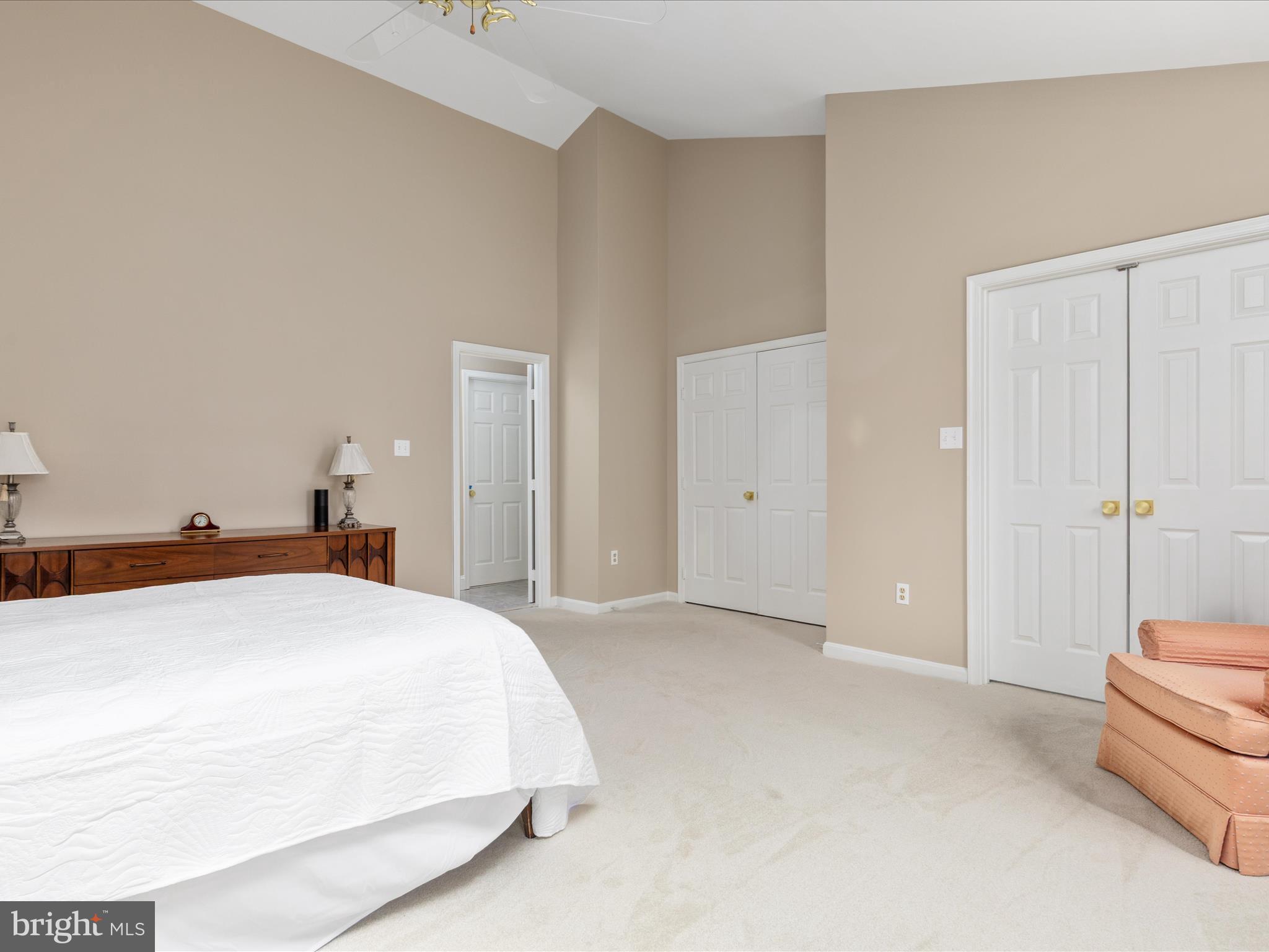 11701 Henderson Road Clifton, VA 20124 - Photo 28 of 61 a spacious bedroom with a bed and a shower