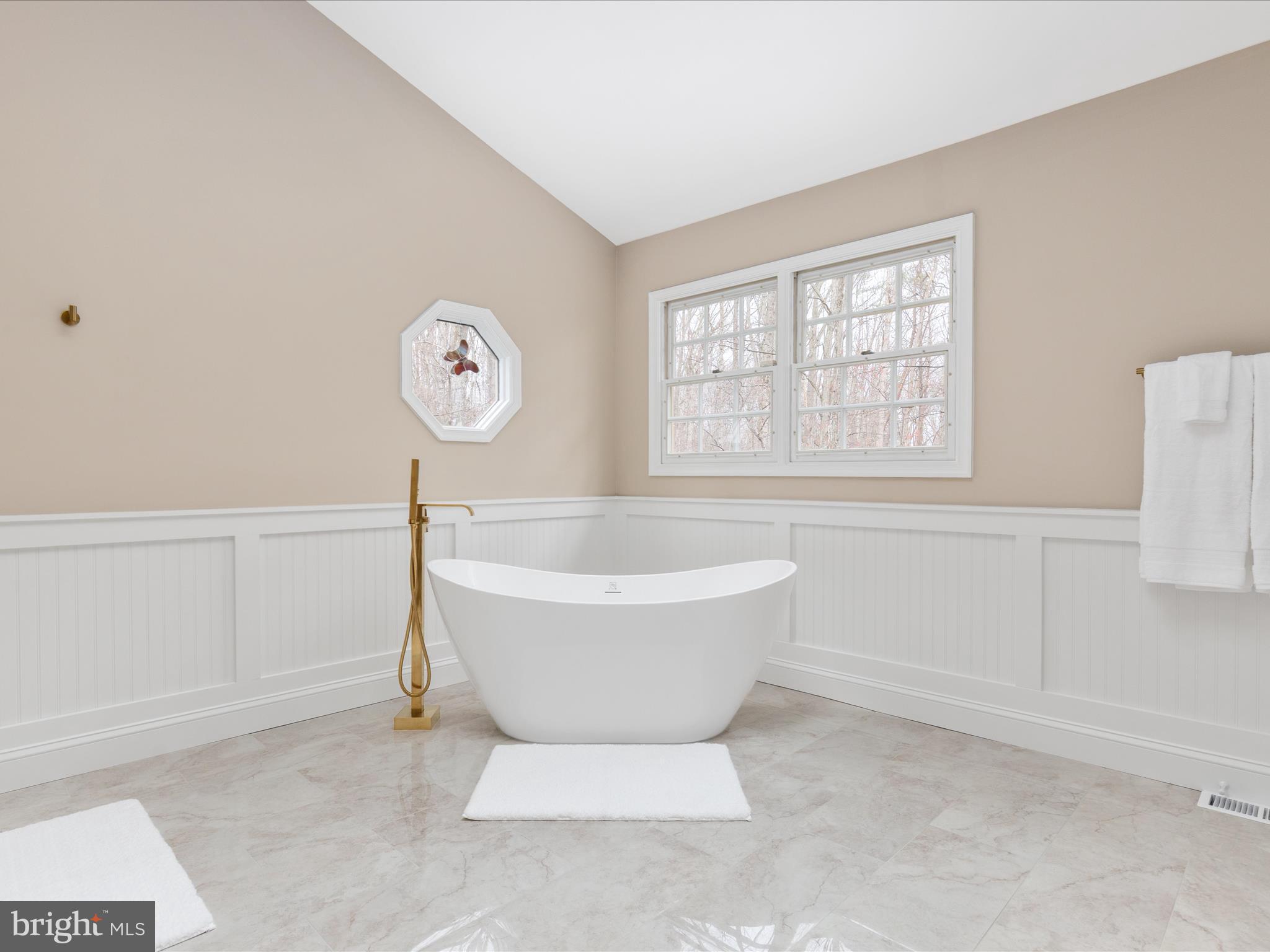 11701 Henderson Road Clifton, VA 20124 - Photo 30 of 61 a white bath tub sitting next to a window