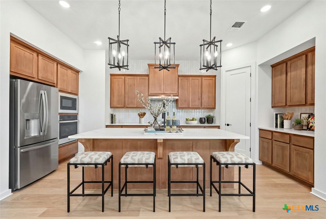 244 Basket Flower Loop Kyle, TX 78640 - Photo 5 of 18 Kitchen - Virtually Staged