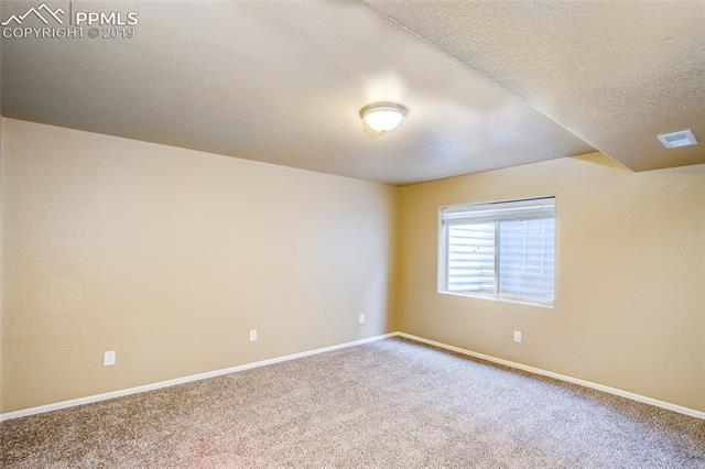 2384 Cinnabar Road Colorado Springs, CO 80921 - Photo 18 of 28 Basement family room.