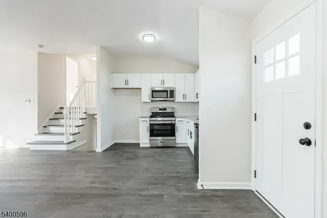 a kitchen with stainless steel appliances a stove and a refrigerator