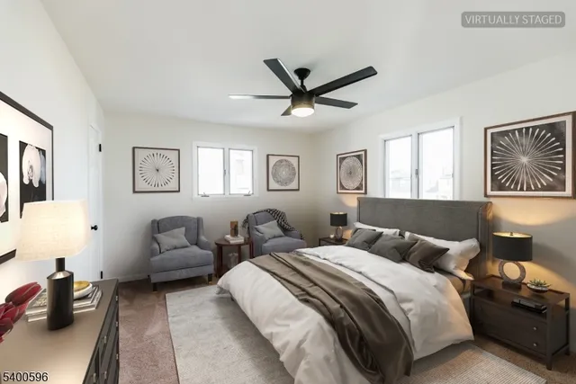 a spacious bedroom with two beds and a couch