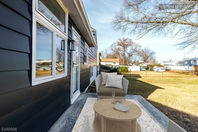 a balcony with table and chairs