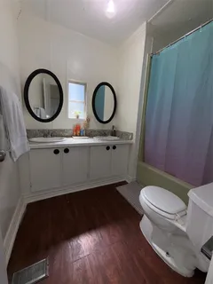 a bedroom with a bed and a baby crib