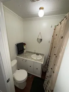 a kitchen with sink refrigerator and stove