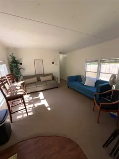 a kitchen with stainless steel appliances granite countertop refrigerator a stove and a refrigerator