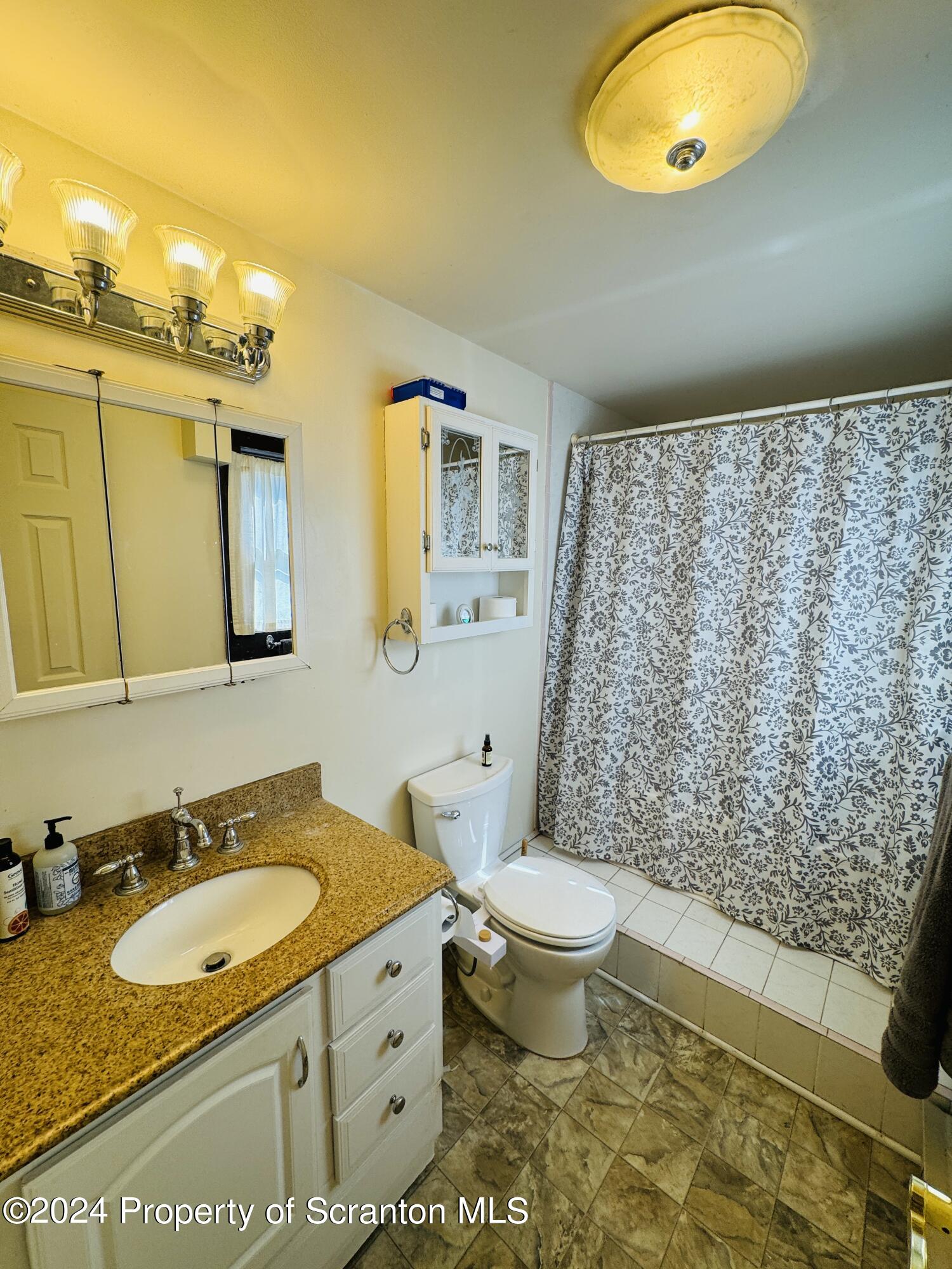 1590 State Rte 4002 Mehoopany, PA 18629 - Photo 13 of 38 a bathroom with a granite countertop sink and a mirror