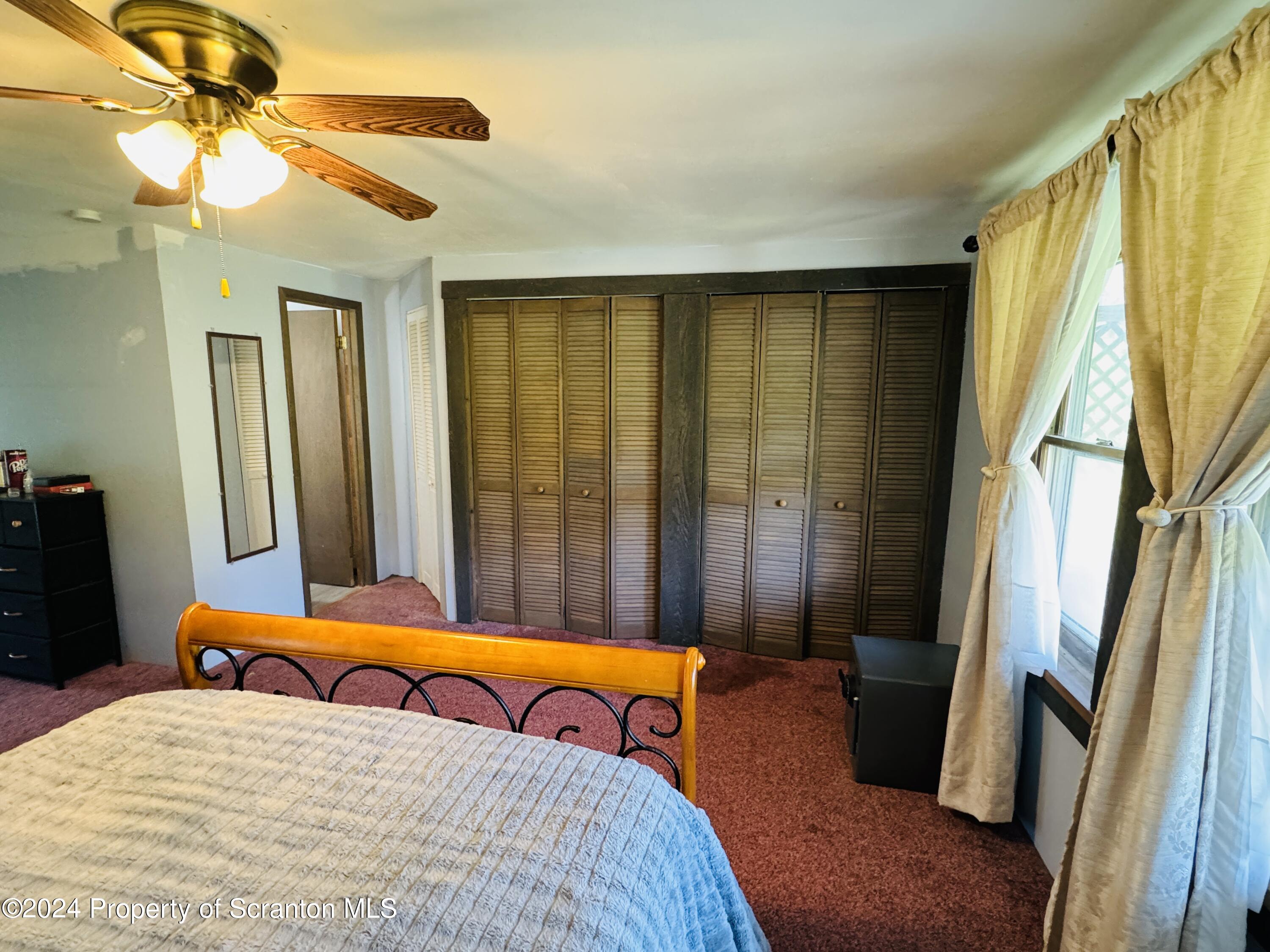 1590 State Rte 4002 Mehoopany, PA 18629 - Photo 16 of 38 a bedroom with a bed and a window