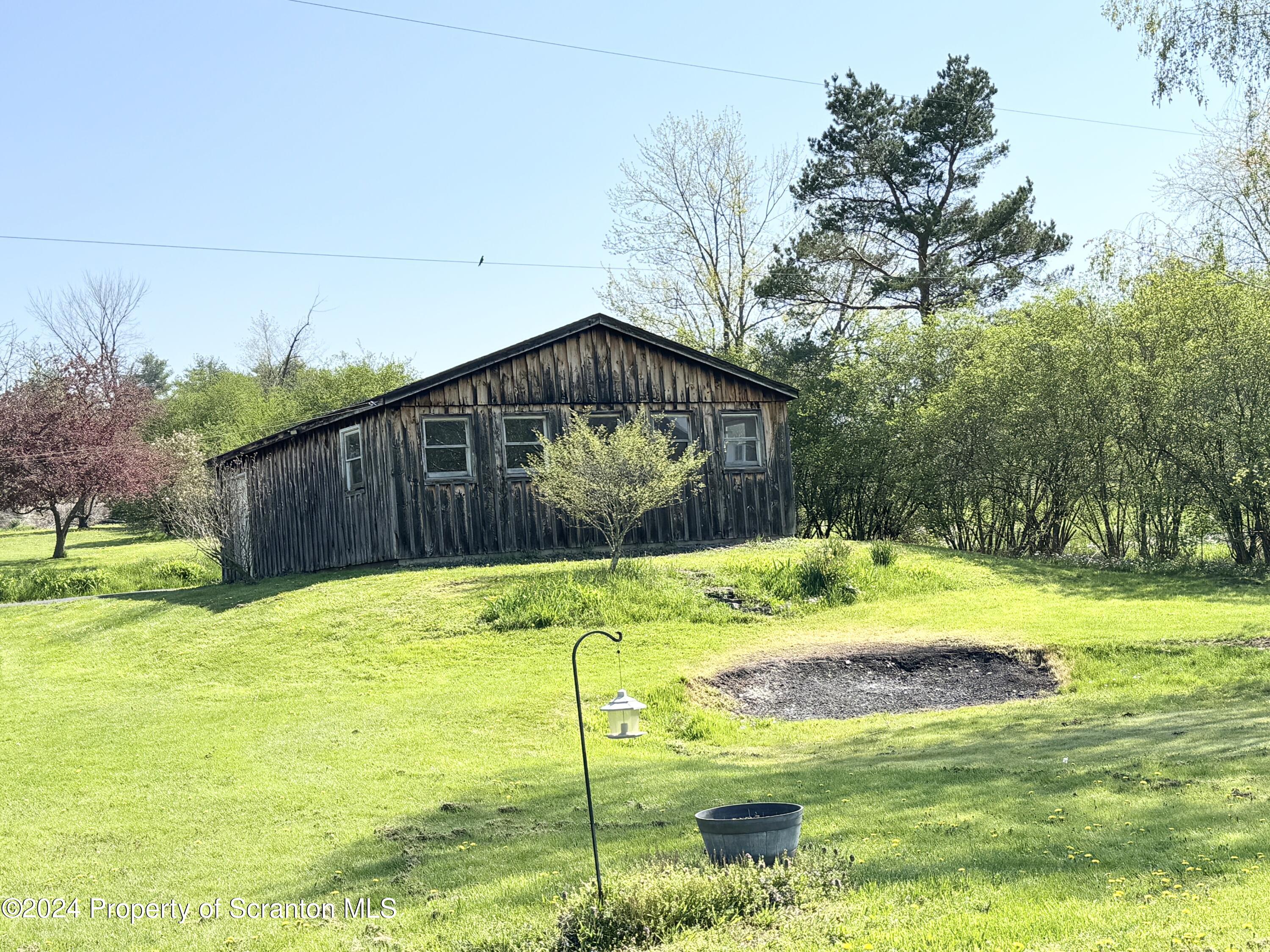 1590 State Rte 4002 Mehoopany, PA 18629 - Photo 30 of 38 a view of a backyard with swimming pool