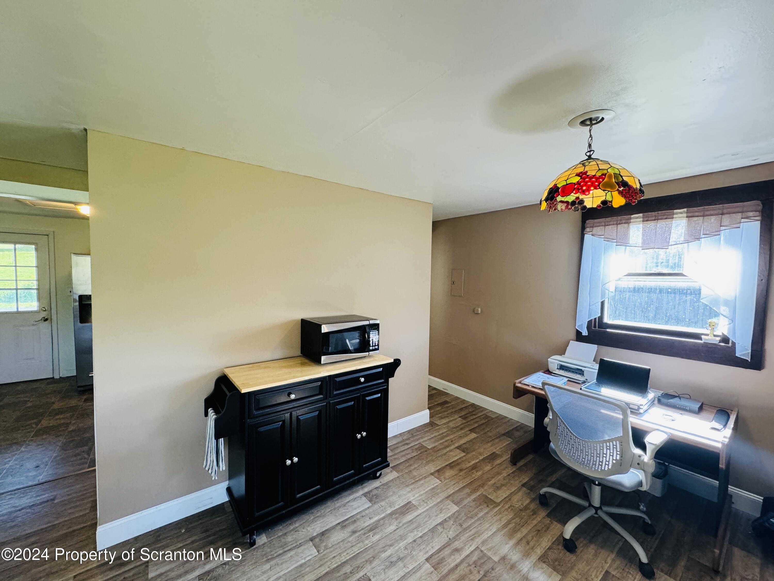 1590 State Rte 4002 Mehoopany, PA 18629 - Photo 10 of 38 a room with furniture and wooden floor