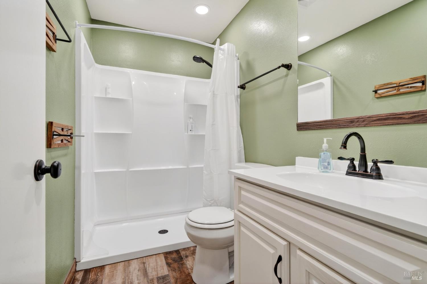 4526 Hillview Court Rohnert Park, CA 94928 - Photo 16 of 28 a bathroom with a sink a toilet and shower