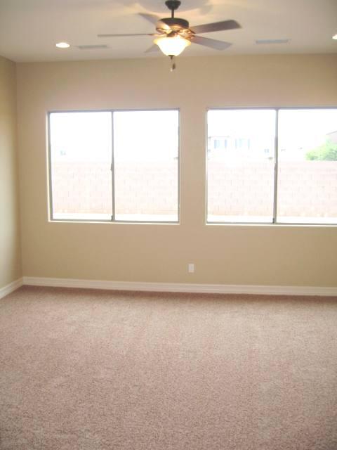 2851 East Blue Sage Road Gilbert, AZ 85297 - Photo 8 of 14 an empty room with a window