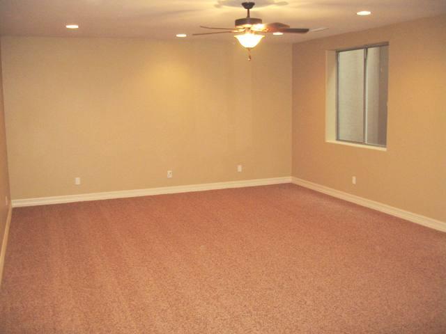 2851 East Blue Sage Road Gilbert, AZ 85297 - Photo 10 of 14 wooden floor in an empty room with a window