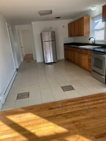 a kitchen with stainless steel appliances granite countertop a sink and cabinets