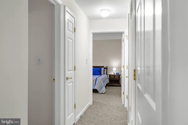 a view of a bedroom with a bed and a closet