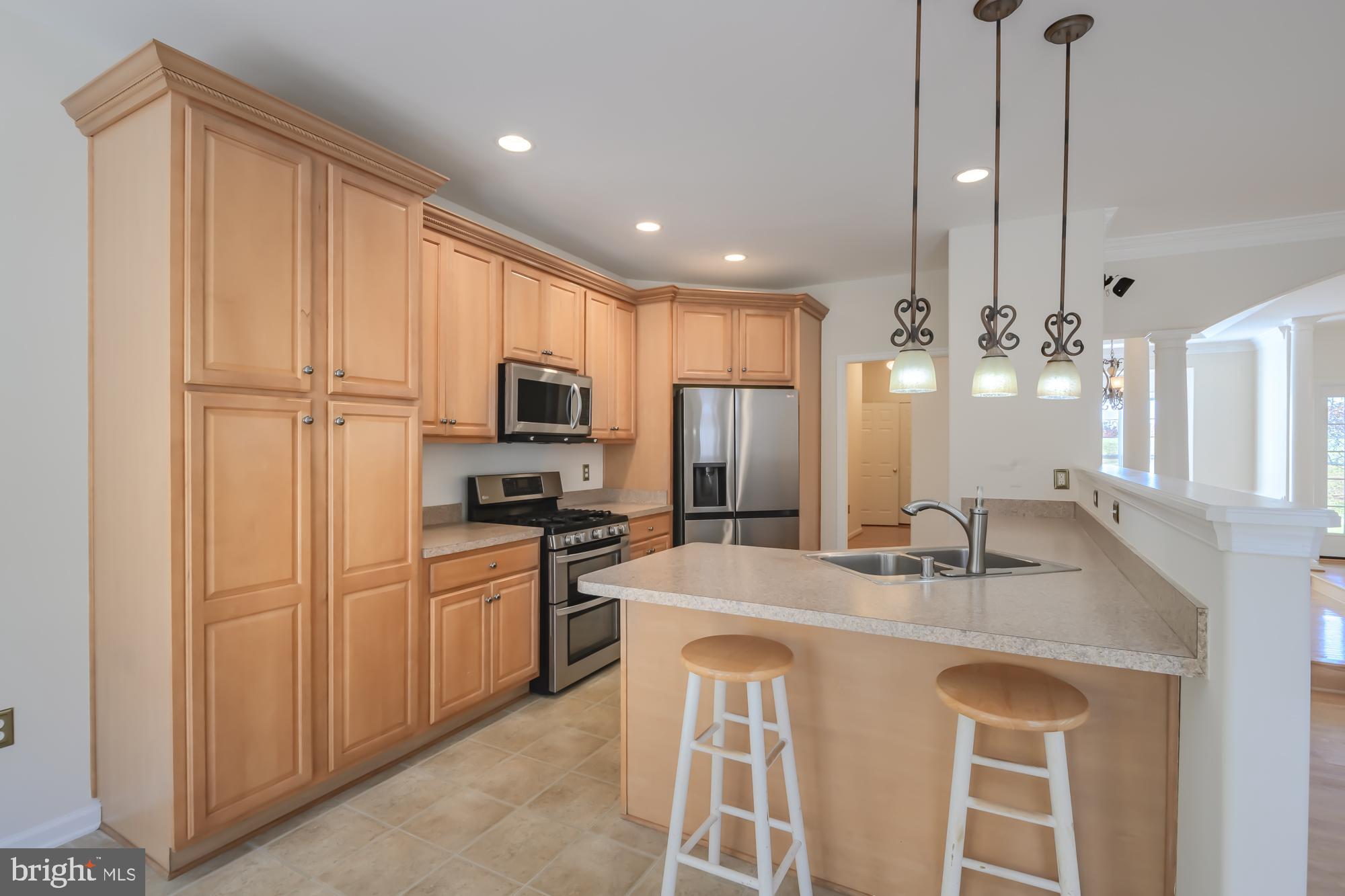 39 River Ridge Lane Fredericksburg, VA 22406 - Photo 17 of 94 Modern kitchen with warm wood cabinetry.
