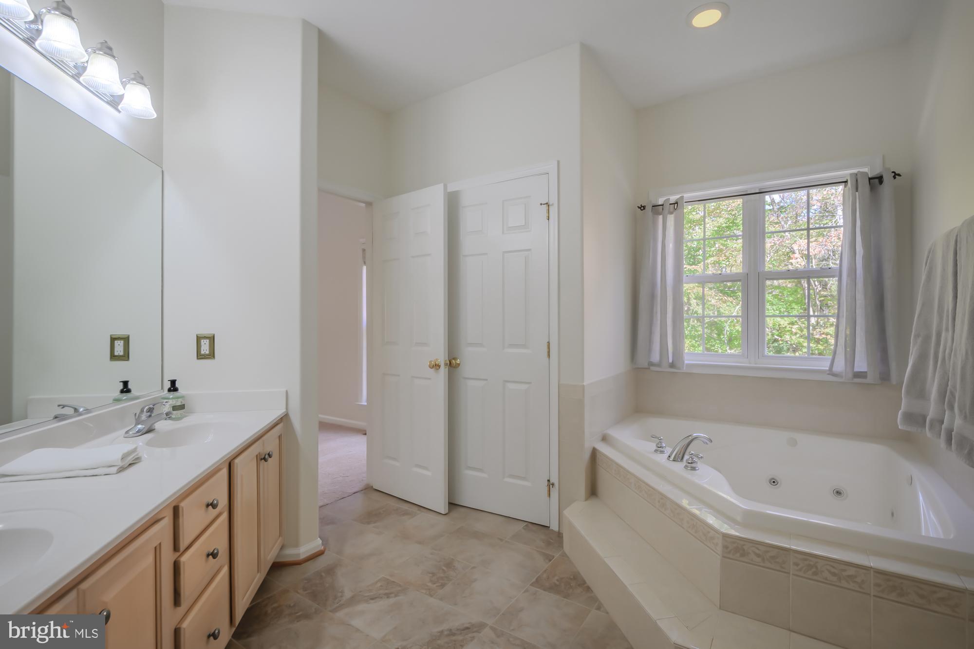 39 River Ridge Lane Fredericksburg, VA 22406 - Photo 35 of 94 Serene bathroom with natural light and elegance.
