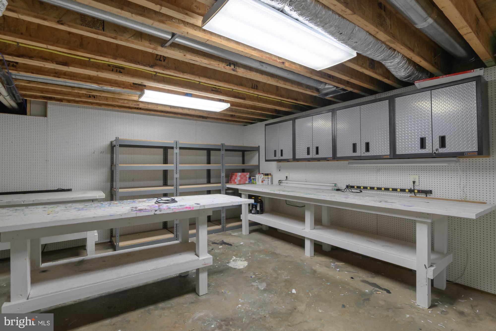 39 River Ridge Lane Fredericksburg, VA 22406 - Photo 60 of 94 Spacious workshop with ample storage options.