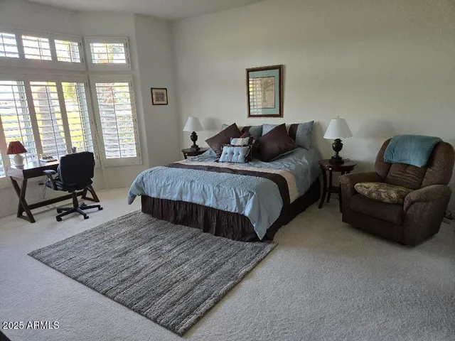 an empty room with closet and wooden floor