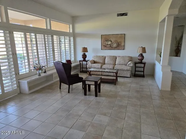 a kitchen with granite countertop a sink a stove and refrigerator