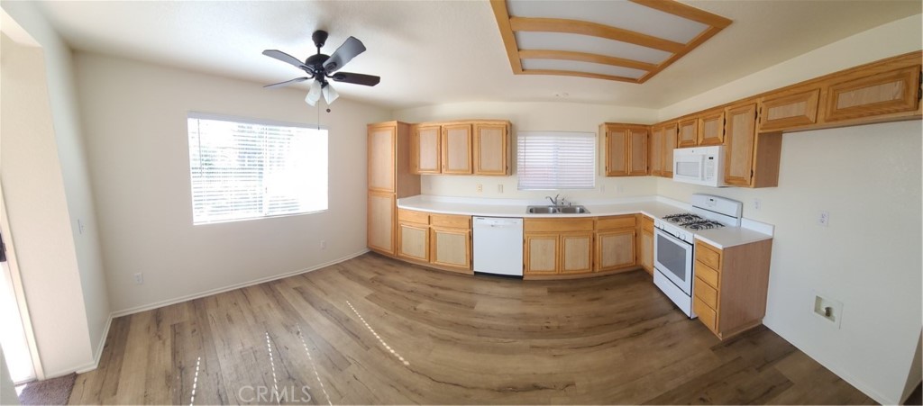 31975 Corte Algete Temecula, CA 92592 - Photo 3 of 15 a kitchen with stainless steel appliances granite countertop a stove a sink and a refrigerator