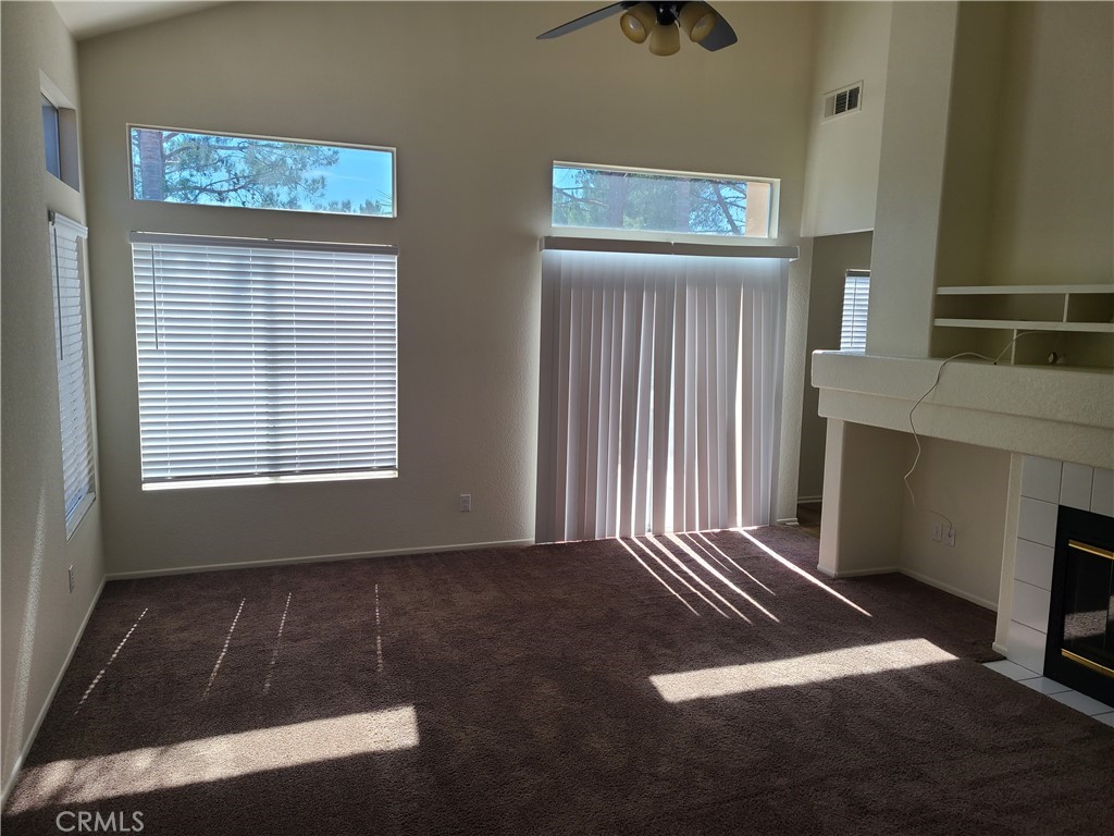 31975 Corte Algete Temecula, CA 92592 - Photo 4 of 15 a view of an empty room with wooden floor and a window