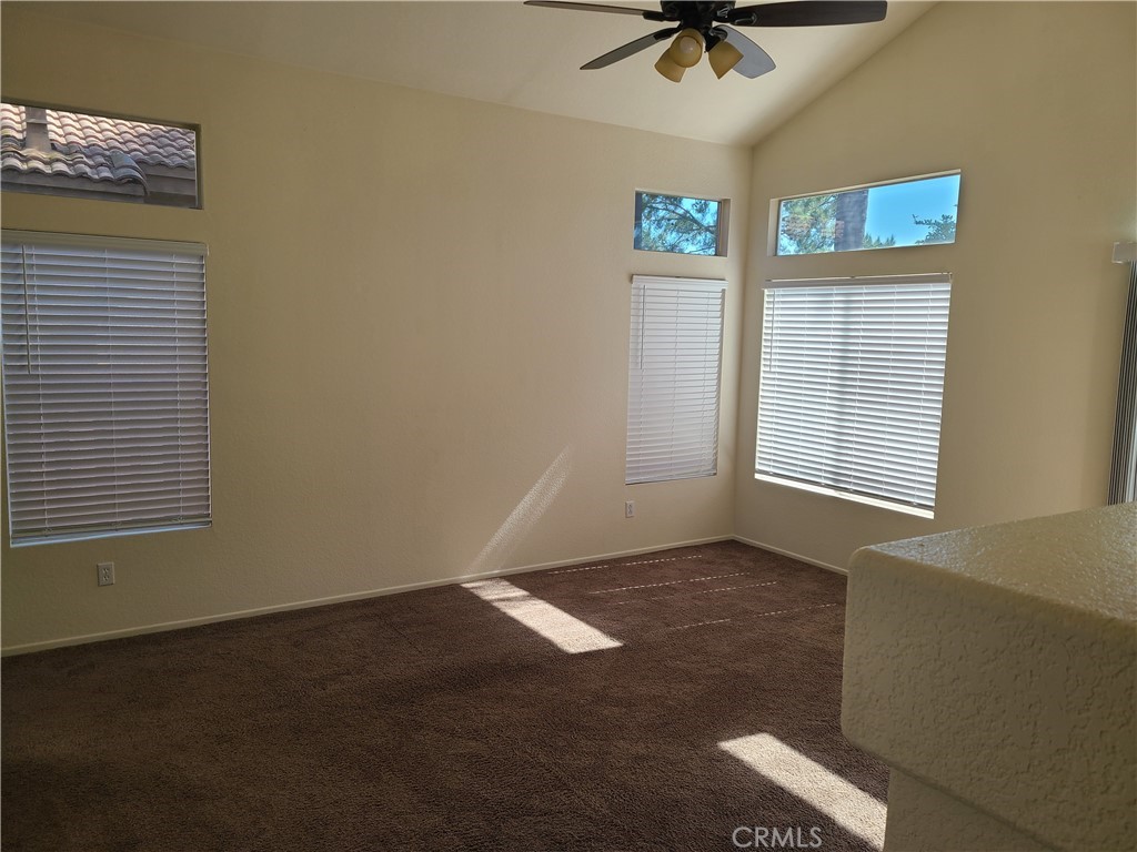 31975 Corte Algete Temecula, CA 92592 - Photo 5 of 15 a view of livingroom with hardwood floor and a ceiling fan