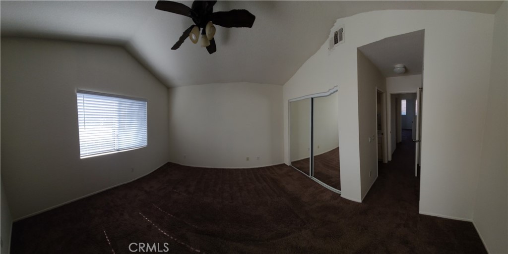 31975 Corte Algete Temecula, CA 92592 - Photo 8 of 15 en empty room with windows and fan